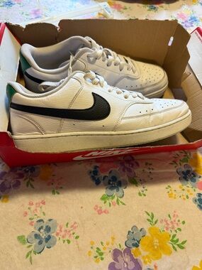 Nike White Low-Top Sneakers with Black Swoosh and Green Heel